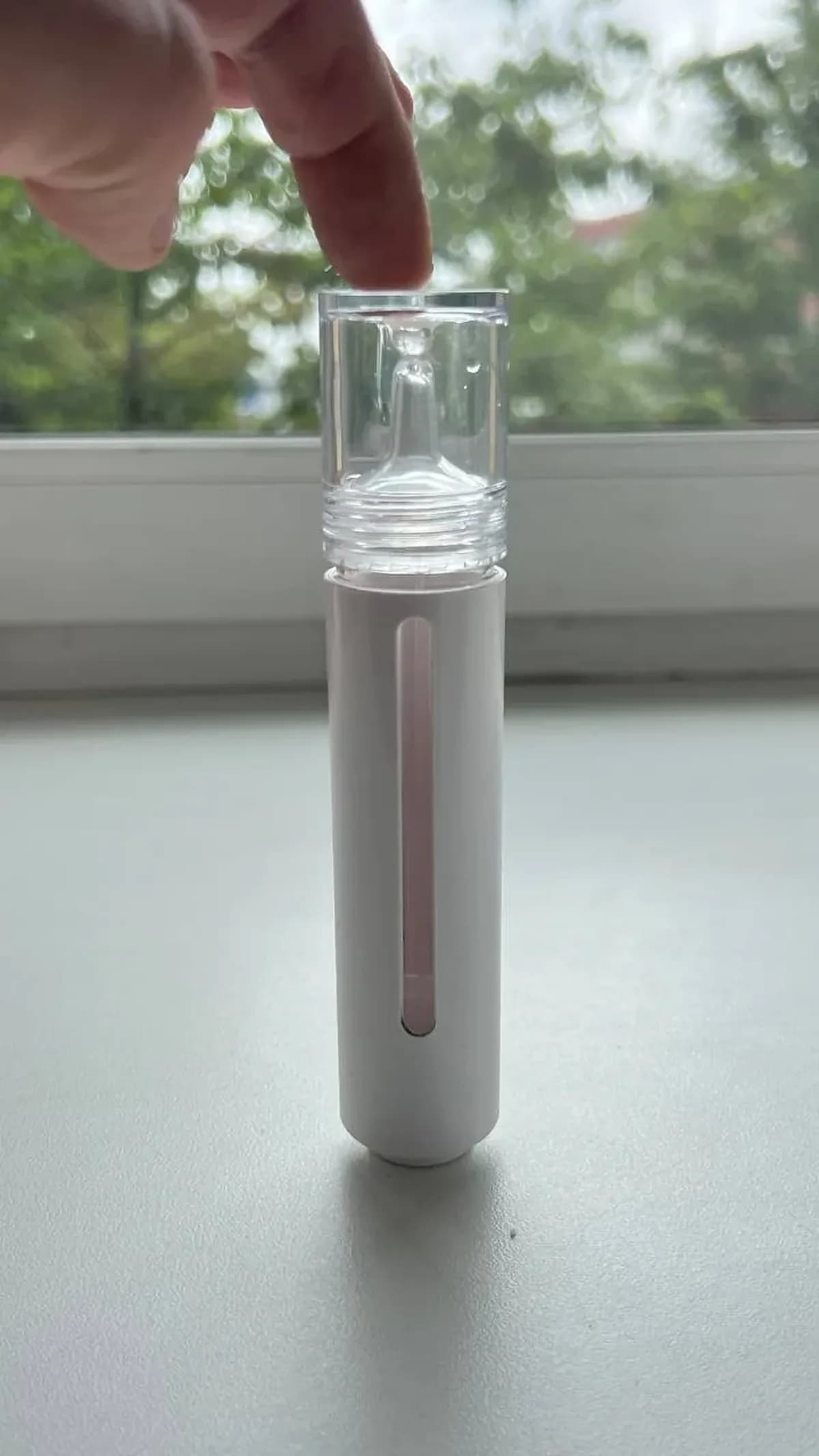 Bacillus F postbiotic drops bottle held in hand