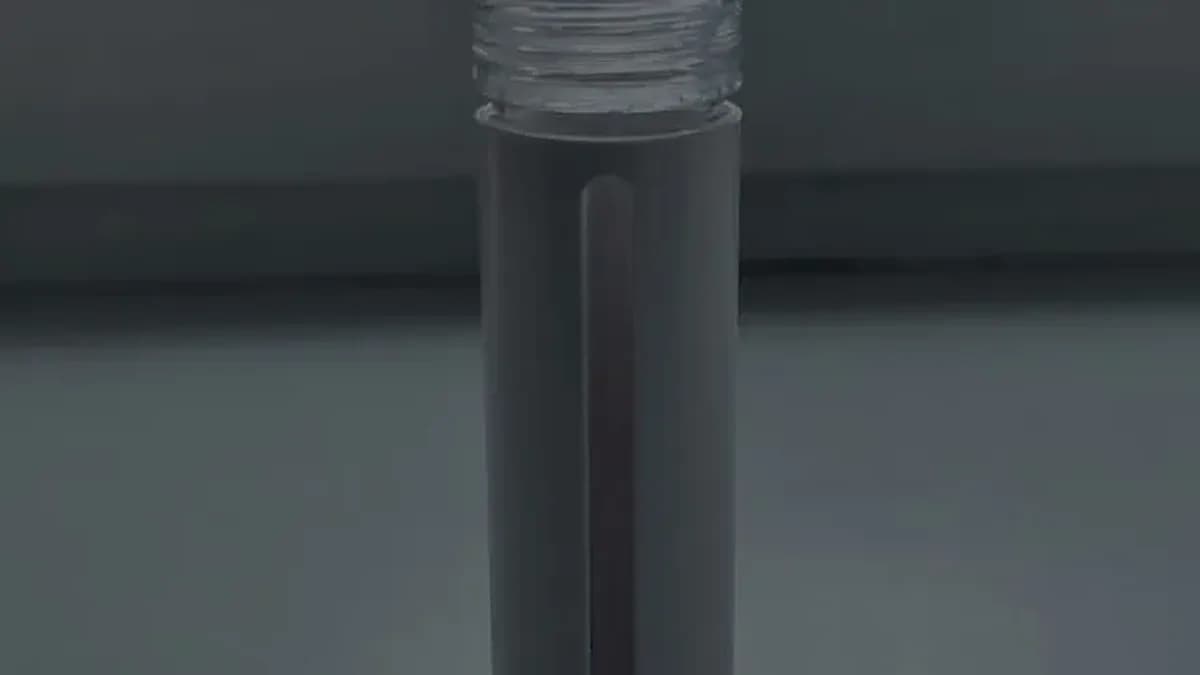 Bacillus F applicator pen held in hand