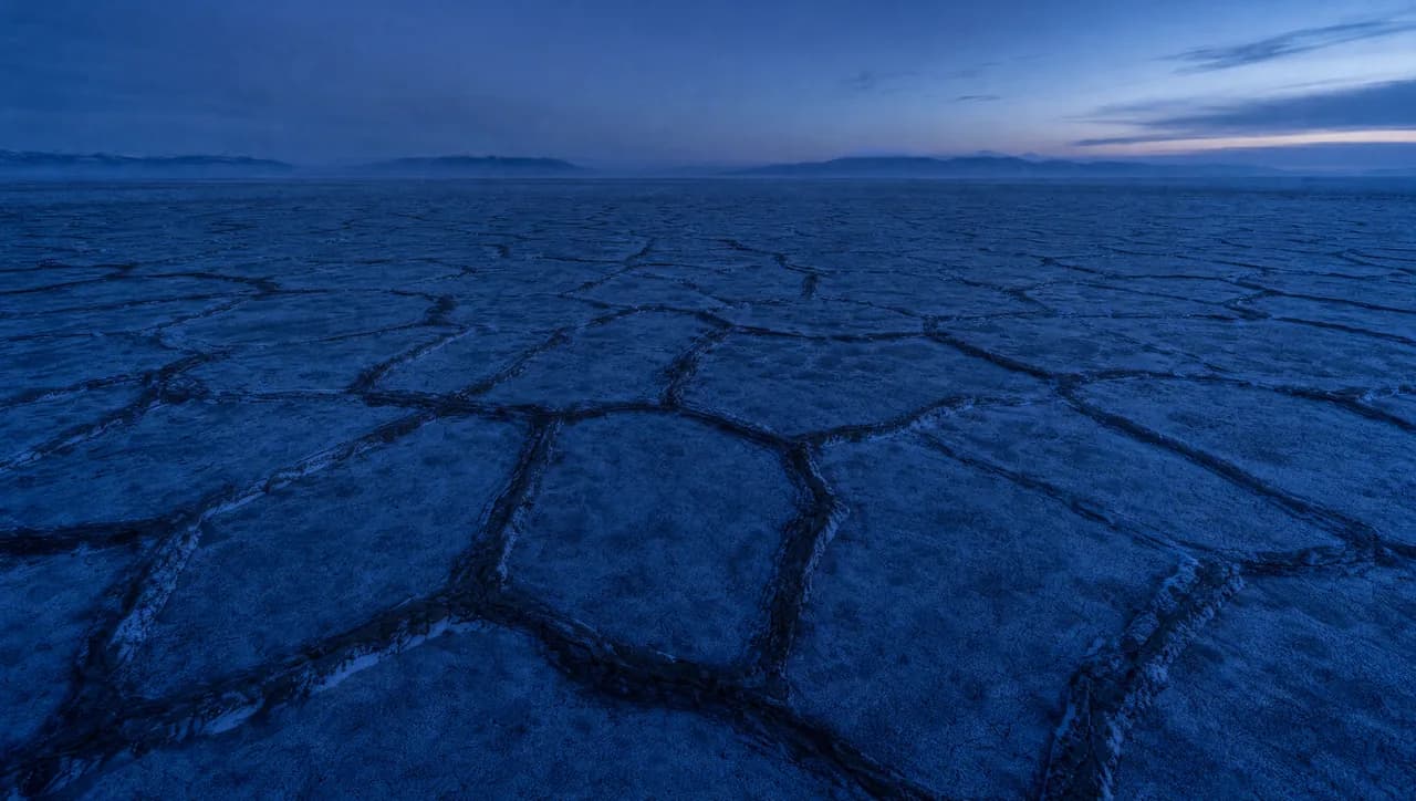 Aerial view of Yakutia permafrost tundra with polygonal frozen ground patterns